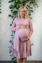 Load image into Gallery viewer, Pregnant lady holding her baby bump in a pink dress

