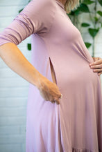 Load image into Gallery viewer, a pregnant lady standing side on pulling a zip down on her side ready for breastfeeding
