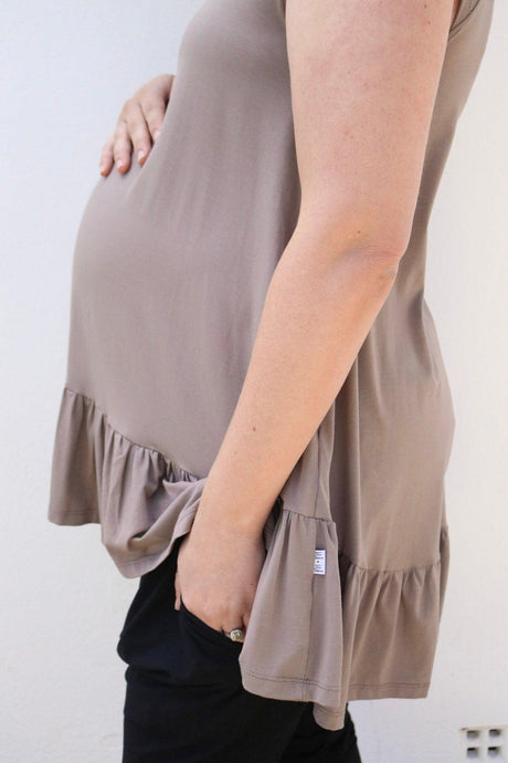 pregnant woman with her hand on her baby bump