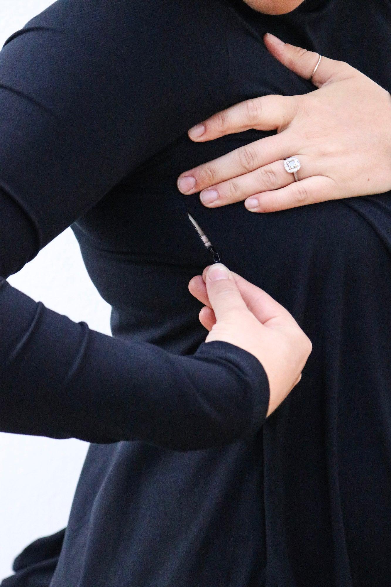 Breastfeeding access on a stylish black maternity dress for pregnant women